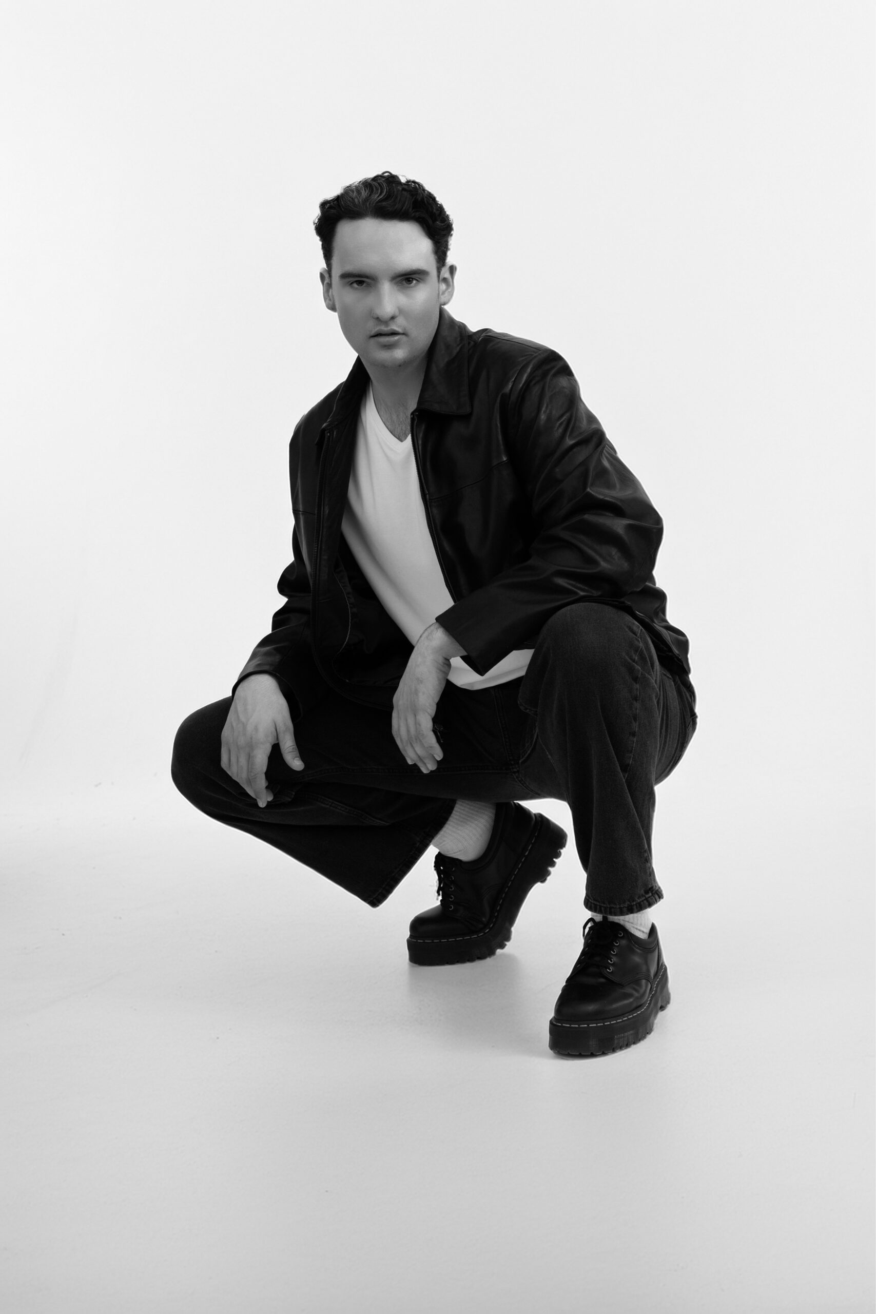 Peyton Farmer in a black leather jacket